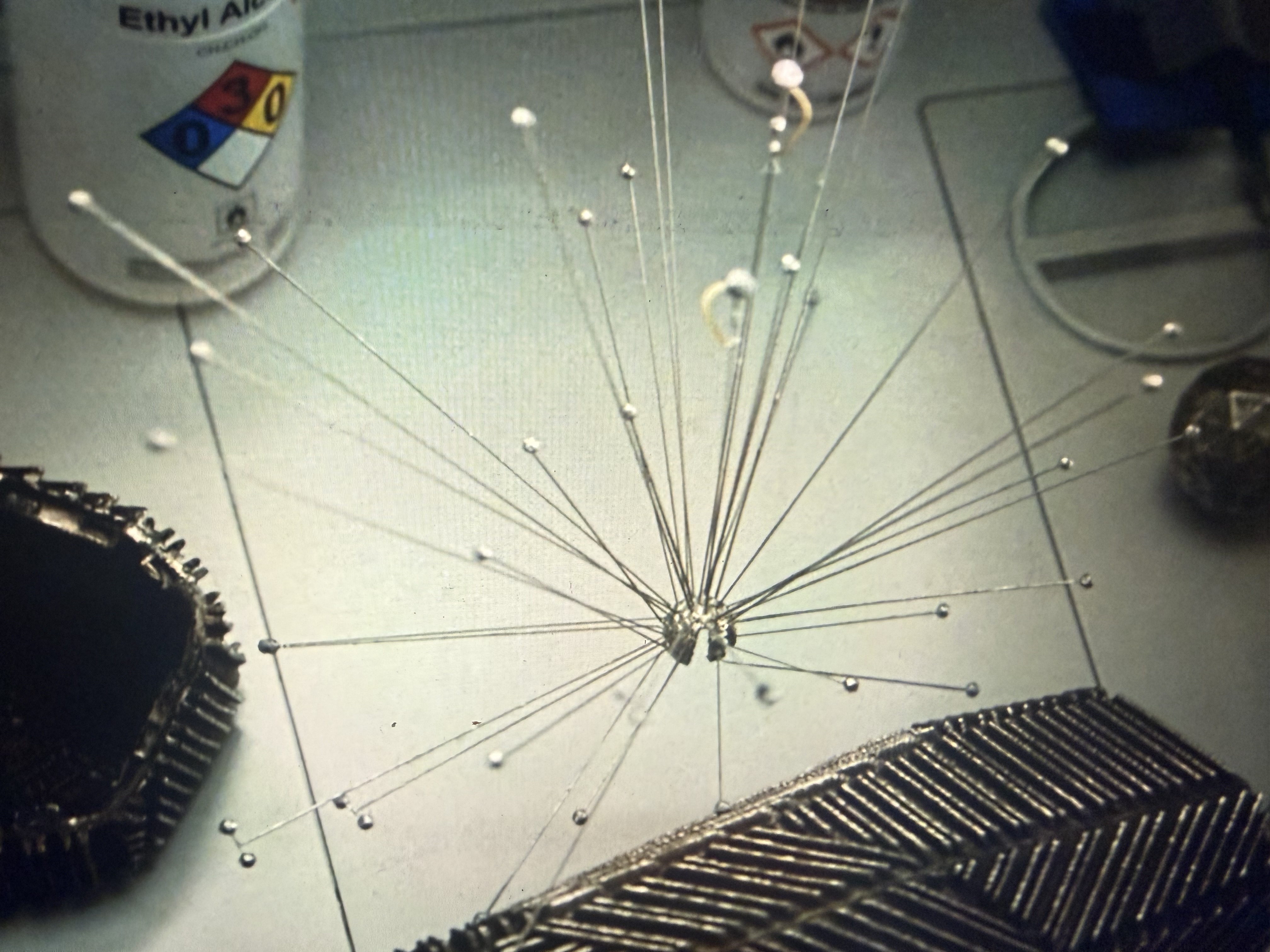 Physical star model made of wire and beads radiating from a central point, from the movie Project Hail Mary